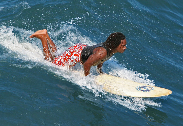 surfer catching a wave
